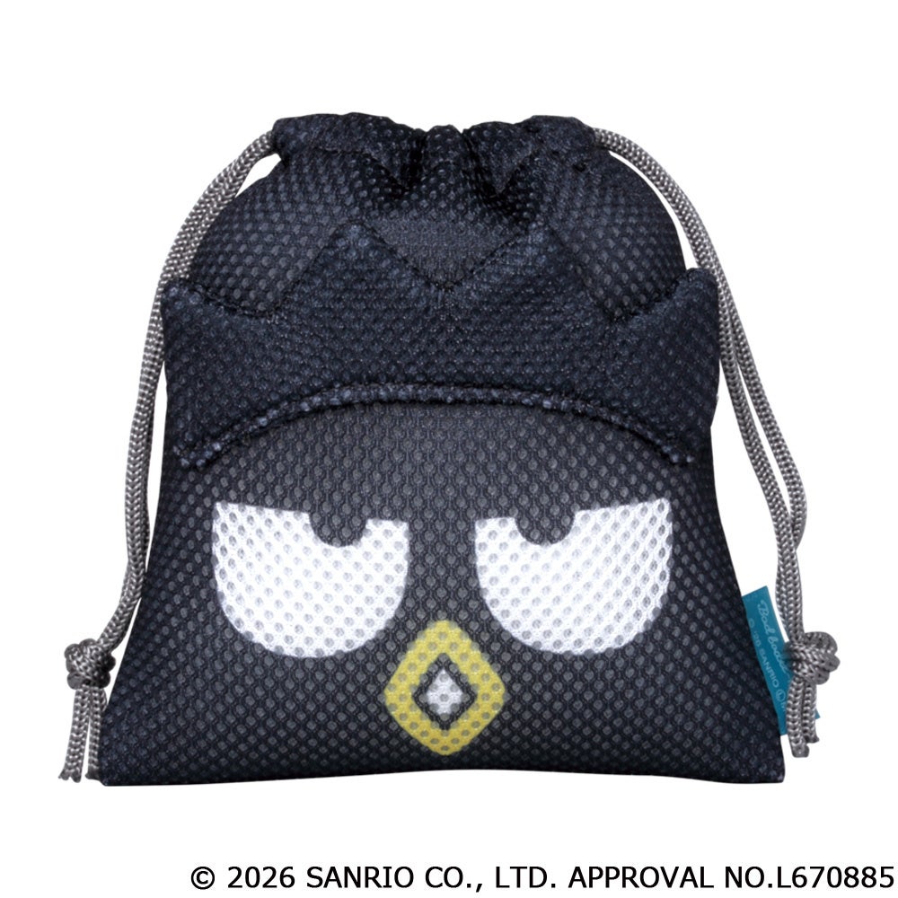 バッドばつ丸。黒い本体に白い目と黄色い口元